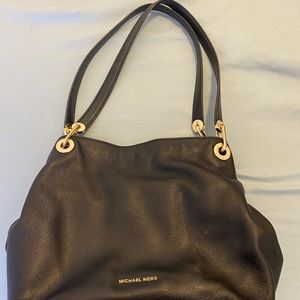 Lightly used multi compartment Michael Kors Purse
